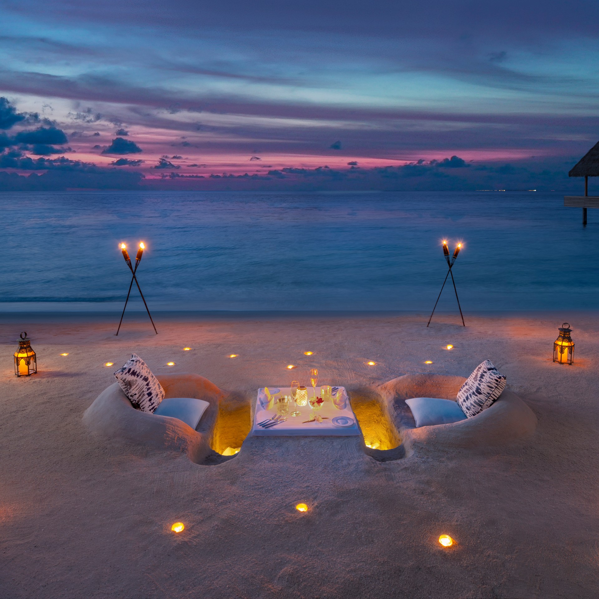 beach sand dinner sunset hotel Waldorf Astoria Maldives Ithaafushi