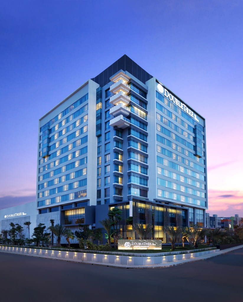 exterior facade of DoubleTree by Hilton Jakarta Kemayoran at dusk