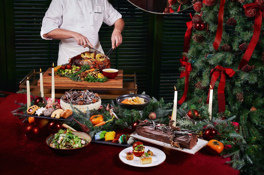 Conrad Singapore Orchard - Tea Lounge - Christmas Day High Tea - chef cutting meats behind a table of food