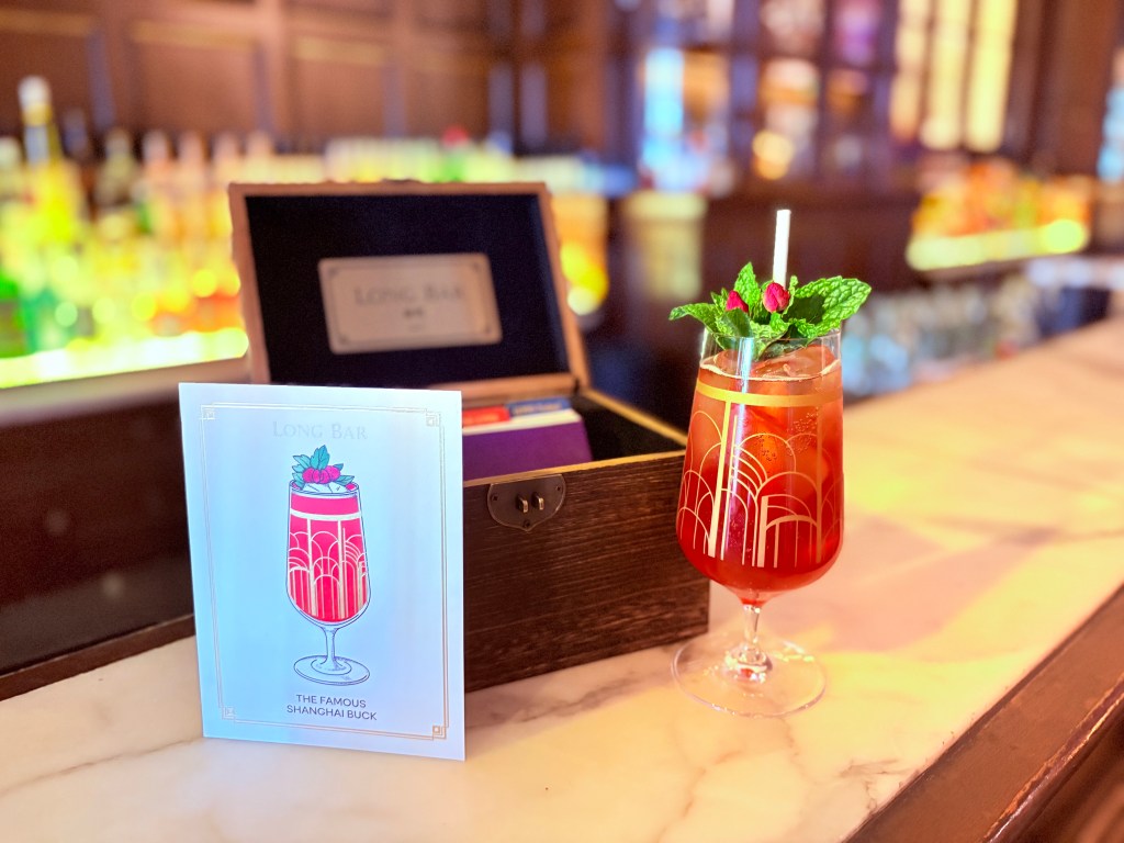 Waldorf Astoria Shanghai on the Bund’s Long Bar, Shanghai Buck with card, gold design on stemmed glass, fresh mint garnish, flower garnish