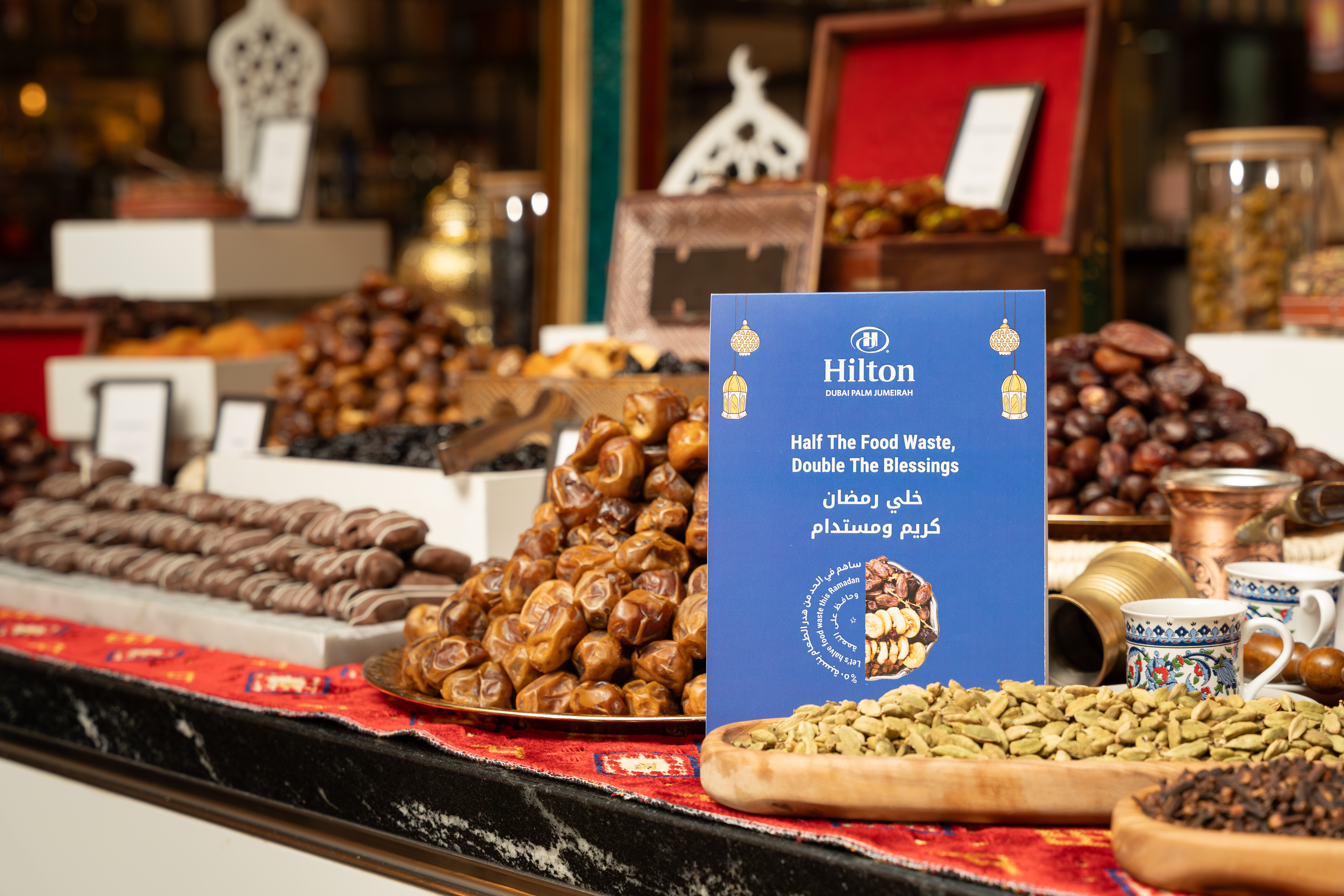 Dessert buffet with Hilton Green Ramadan 2025 signage