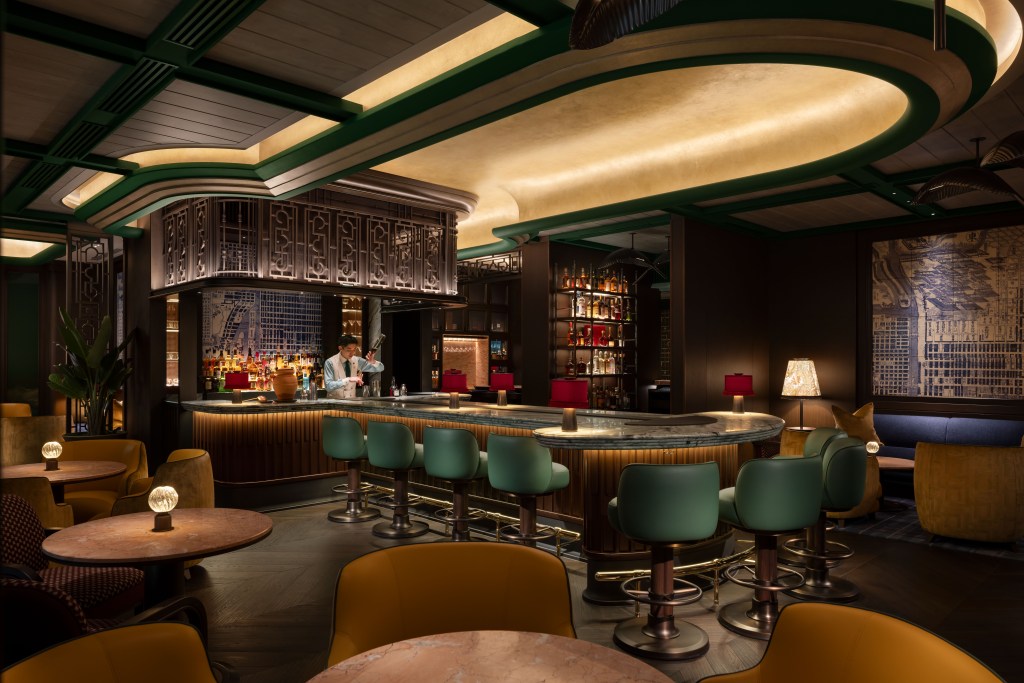 Waldorf Astoria Osaka bar and restaurant with bartender pouring a drink