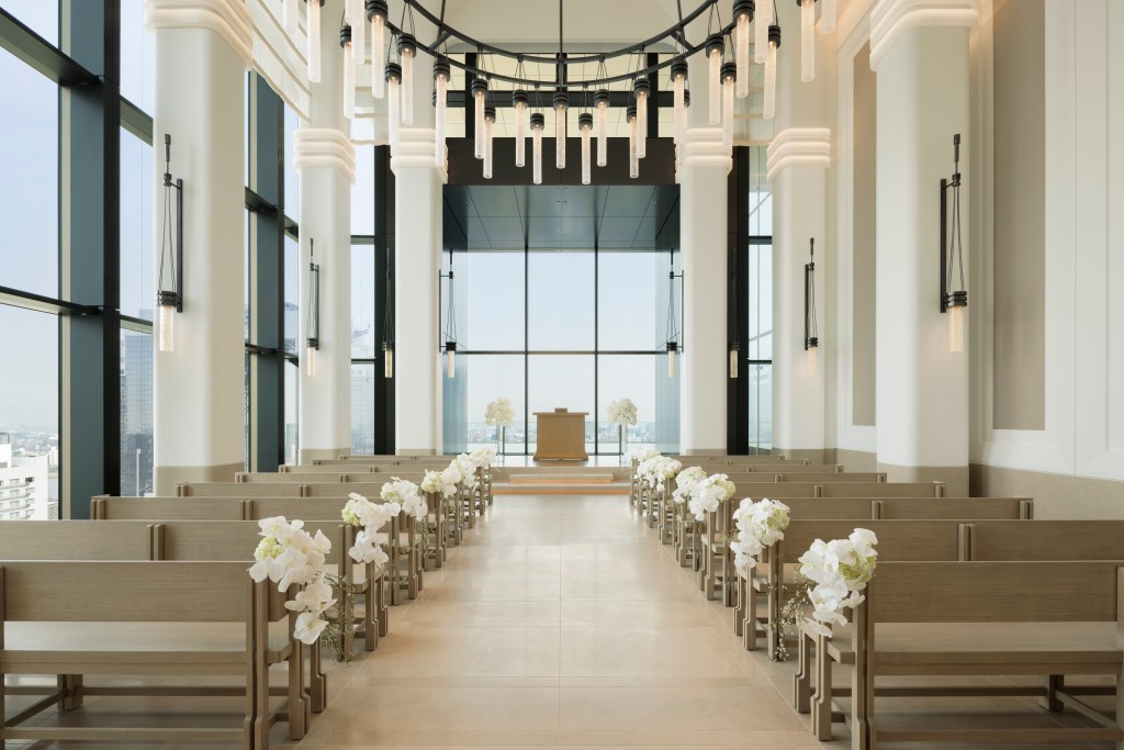 Waldorf Astoria Osaka Wedding Chapel with pulpit and lectern and pews decorated with white flowers
