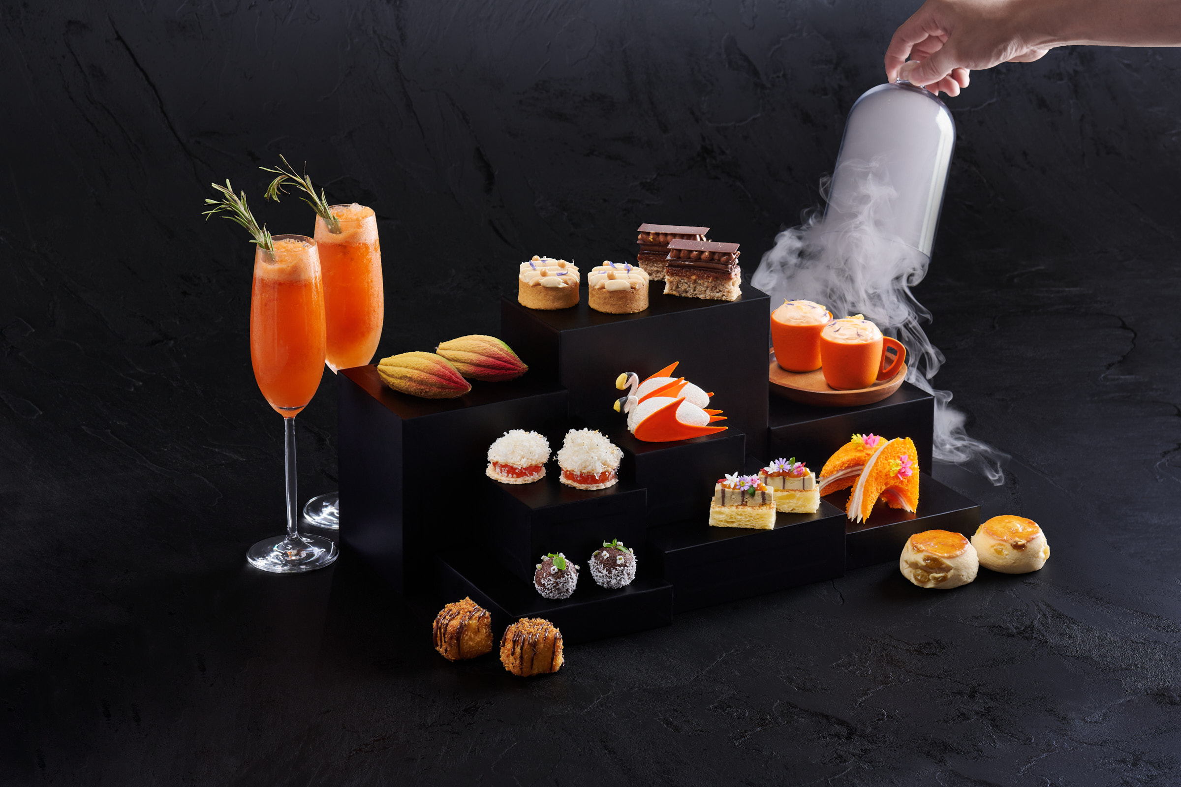 An array of papaya orange chocolates and drinks