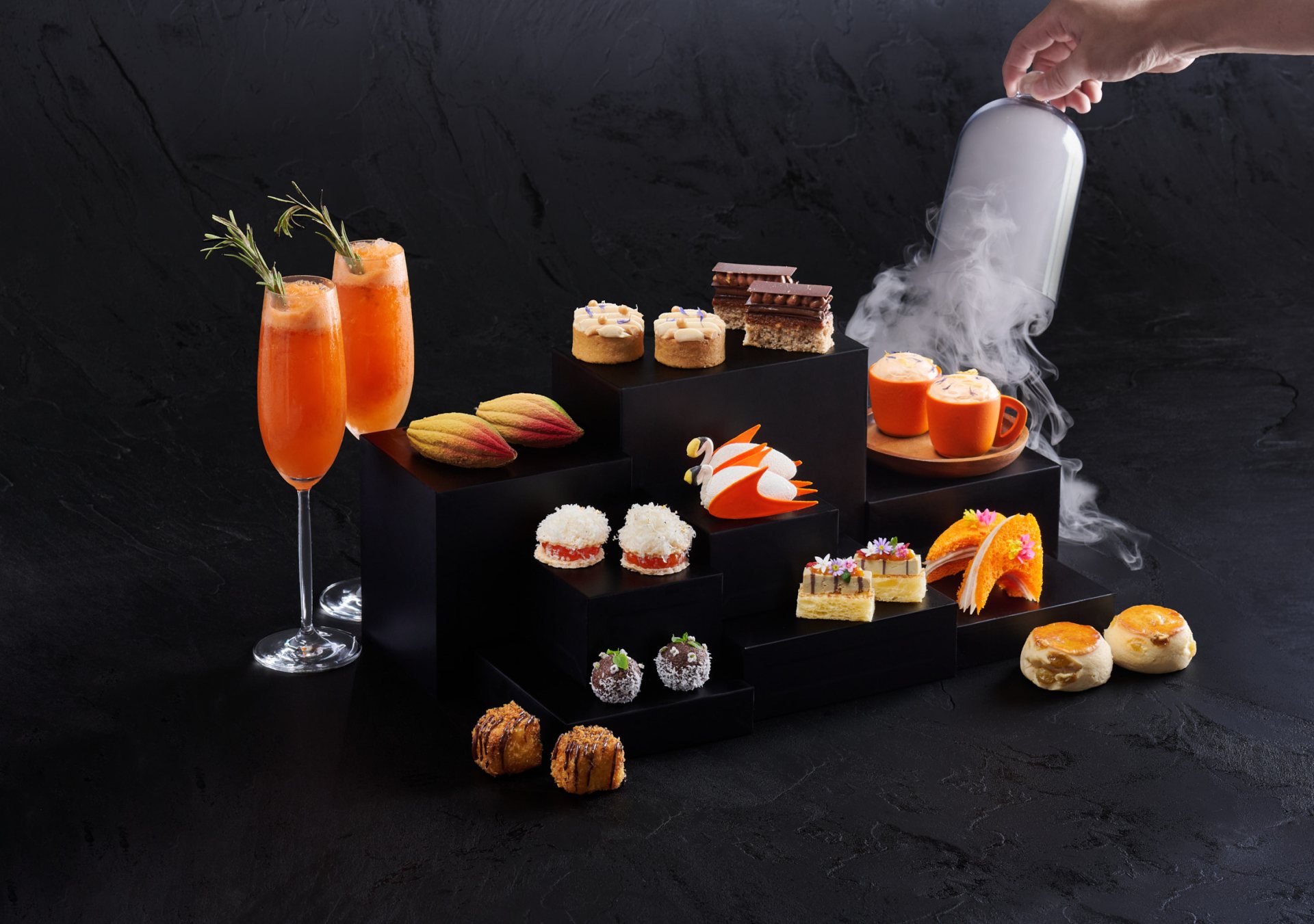 An array of papaya orange chocolates and drinks