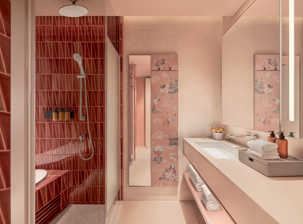 A bathroom with shower, tub, sink