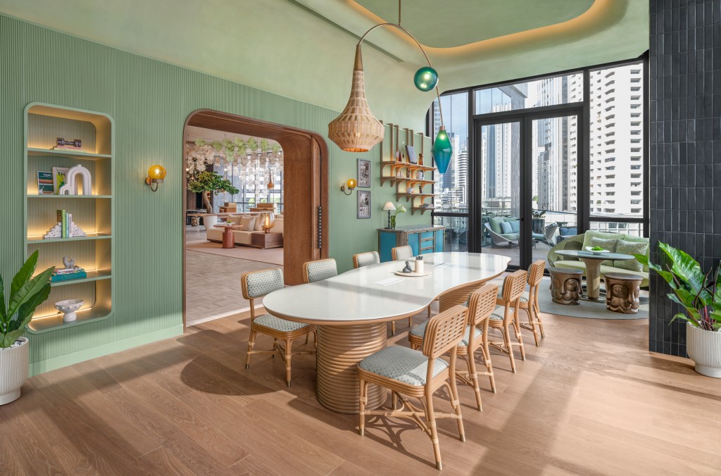 A peaceful space with table for eight and balcony behind