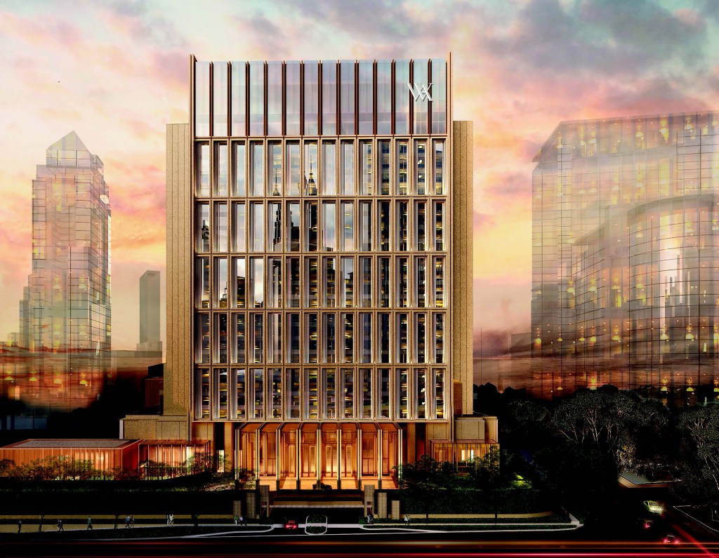 The exterior of the Waldorf Astoria Kuala Lumpur in the city skyline at sunset.