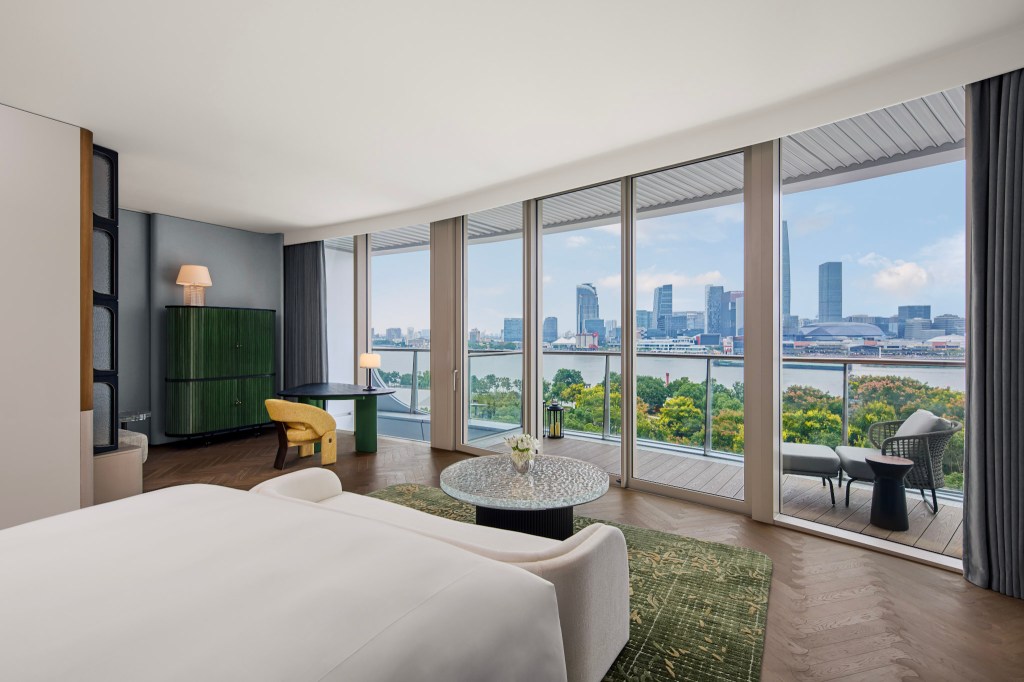 Panoramic king guest room with skyline view at Waldorf Astoria Shanghai Qiantan