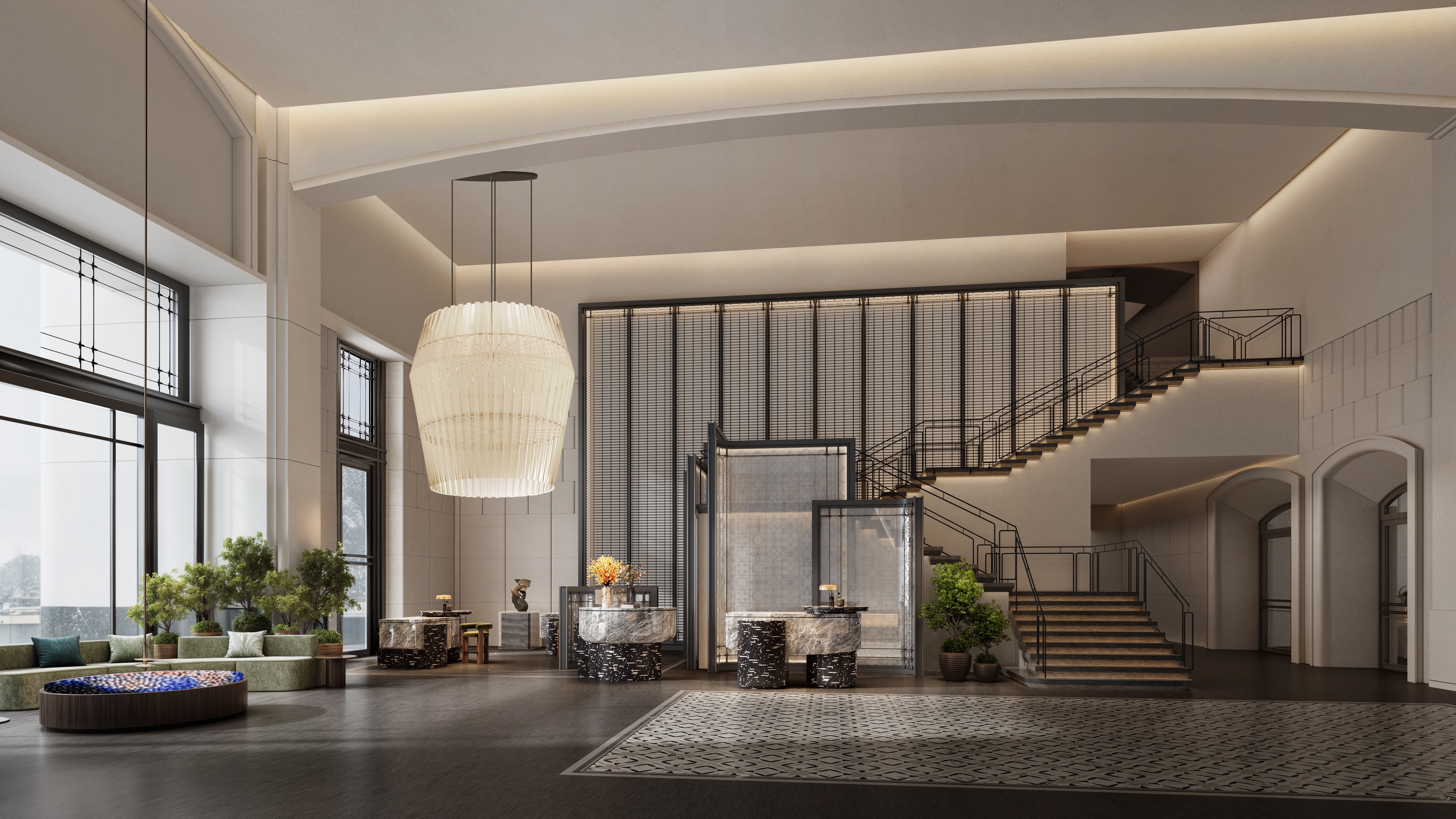 The lobby area with front desks, sitting area, and large staircase