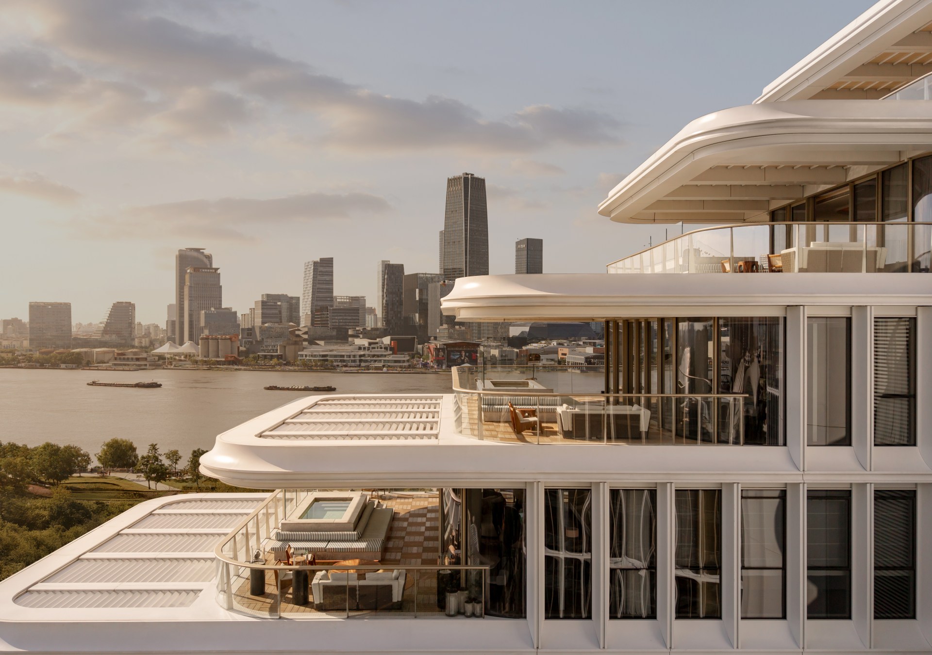 The exterior of the hotel with tiered roofs, looking out over the river and city