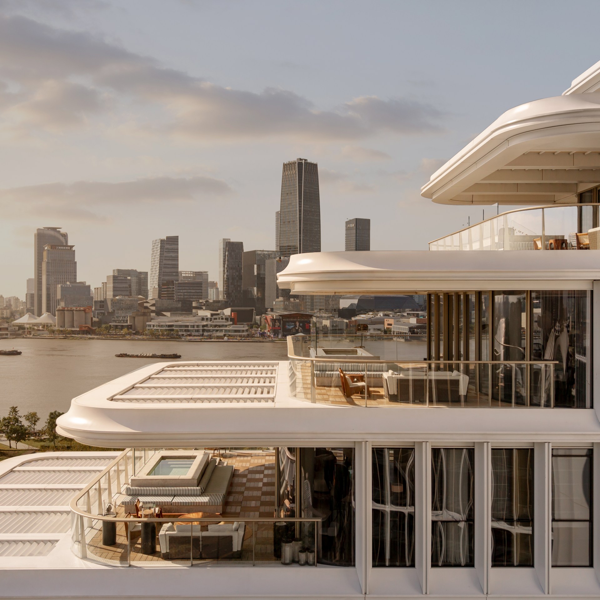 The exterior of the hotel with tiered roofs, looking out over the river and city