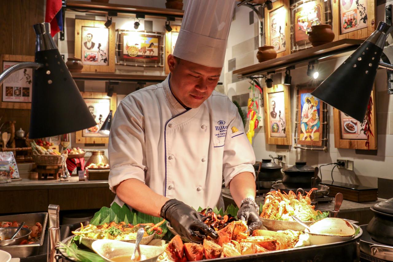 Chef Lord Carlo Bayaban preparing a platter of food