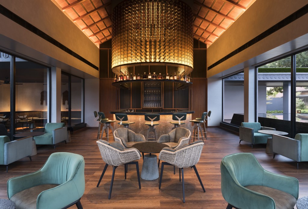 A cozy bar with various seating options,