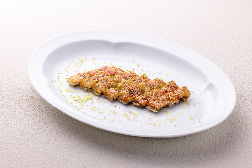 eel strips lined up on a plate