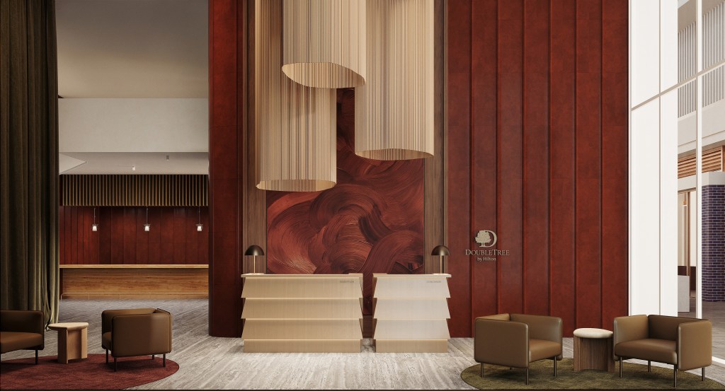 Modern DoubleTree by Hilton Parramatta reception area with two beige desks, brown leather chairs, round rugs, and large cylindrical hanging light fixtures.