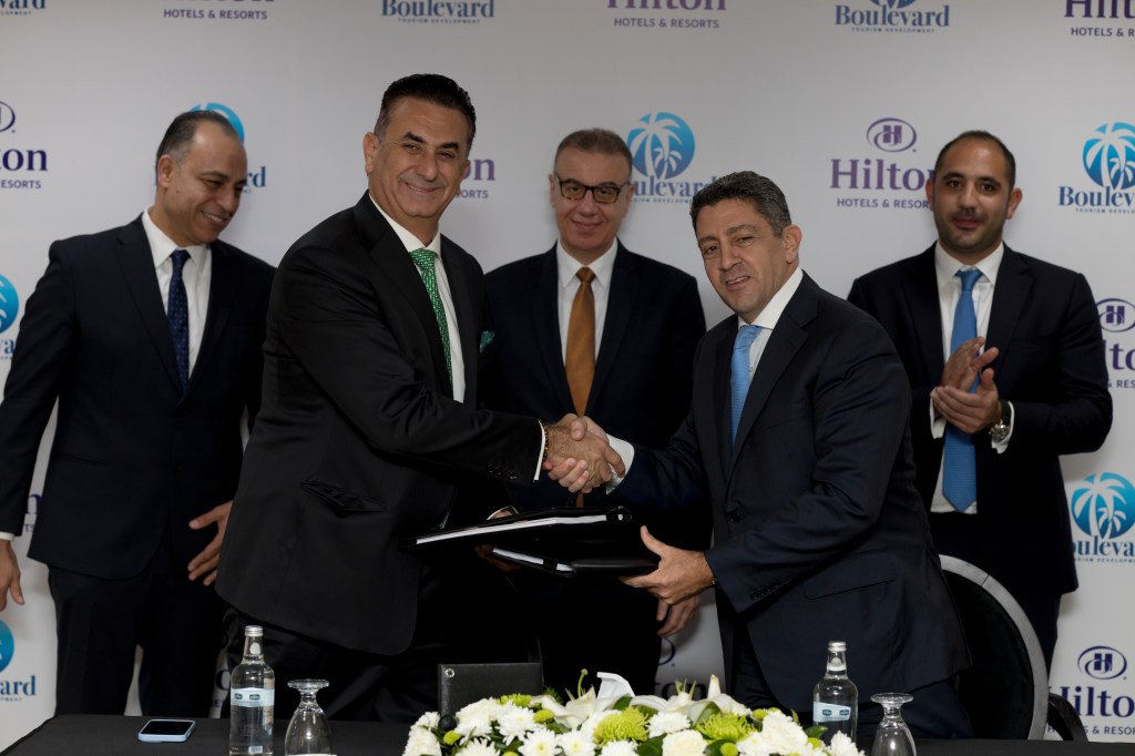 From right to left: Carlos Khneisser, vice president, Development, Middle East &amp; Africa, Hilton shaking hands with Maged Shafik, Founder &amp; Managing Director, Boulevard for Tourism Development.