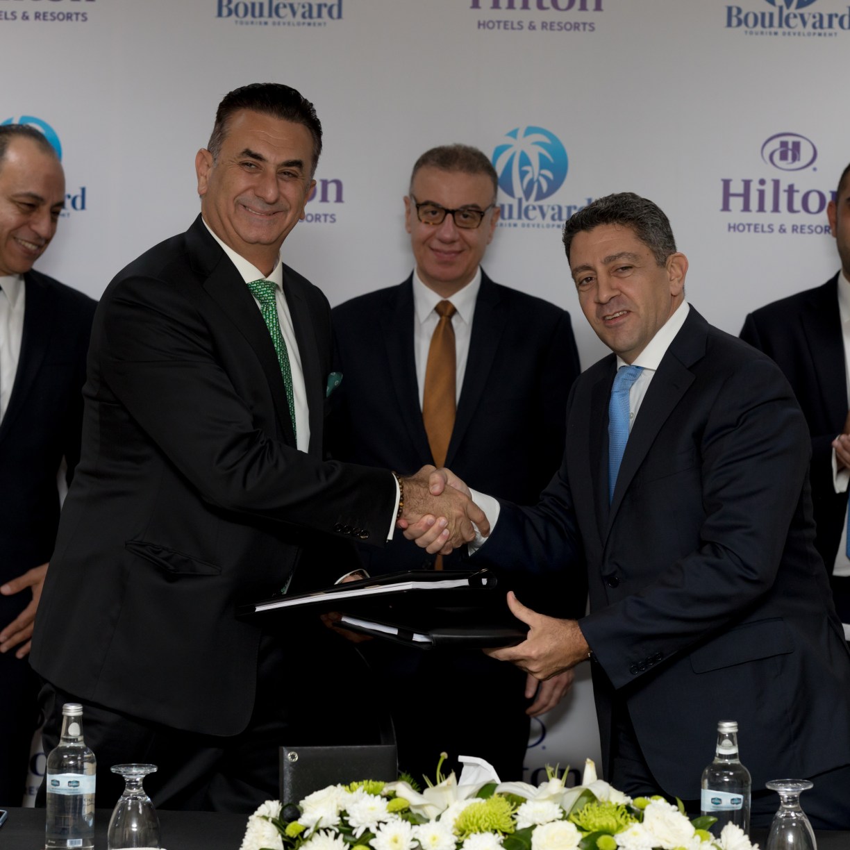 From right to left: Carlos Khneisser, vice president, Development, Middle East & Africa, Hilton shaking hands with Maged Shafik, Founder & Managing Director, Boulevard for Tourism Development.