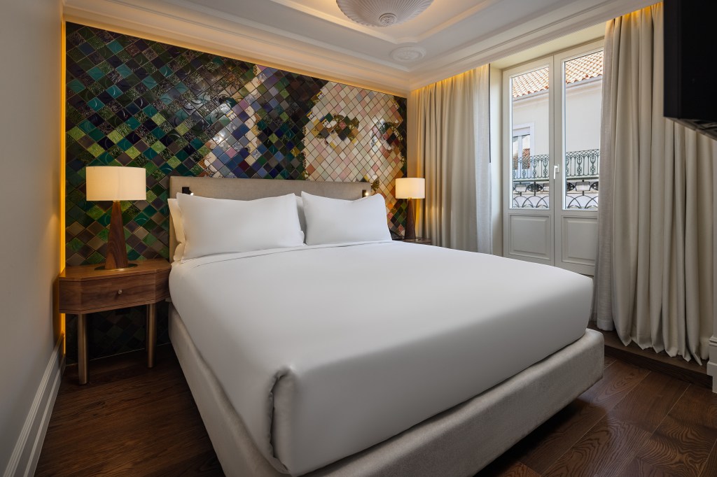 guest room with tile artwork and bed - DUO Hotel Lisbon, Curio Collection by Hilton