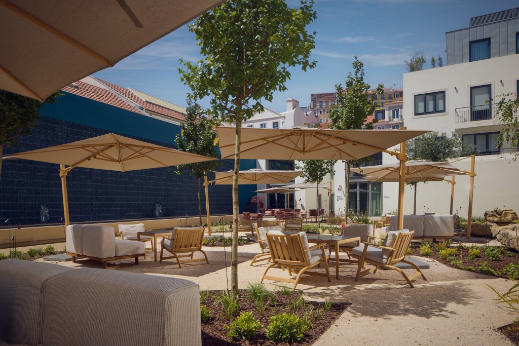 outdoor terrace with seating and umbrellas - DUO Hotel Lisbon, Curio Collection by Hilton