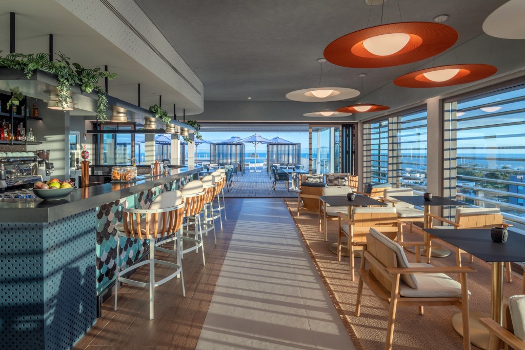 bar and tables leading to outside view at Mistico restaurant at DoubleTree by Hilton Lagoa Azores