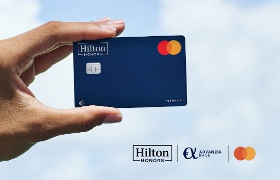 Hand holding the Hilton Honors Advanzia Bank MasterCard Credit Card