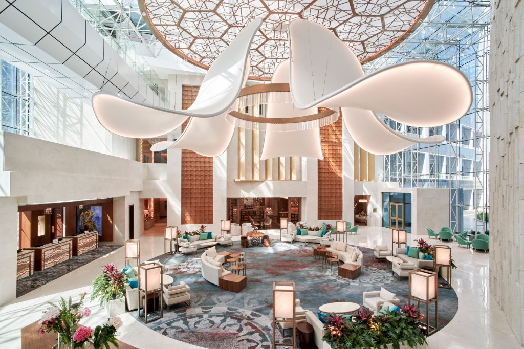 Hilton Cairo Nile Maadi - Lobby, seatubg area in a circular set up, large flower-like chandelier,