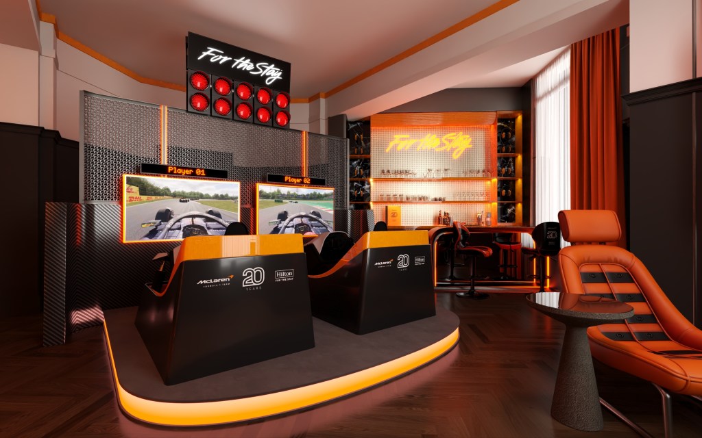 Stay Like McLaren Racing Suite at The Trafalgar St. James London, Curio Collection by Hilton - twin racing simulators, a pit wall with high-intensity race day content, in-room bar