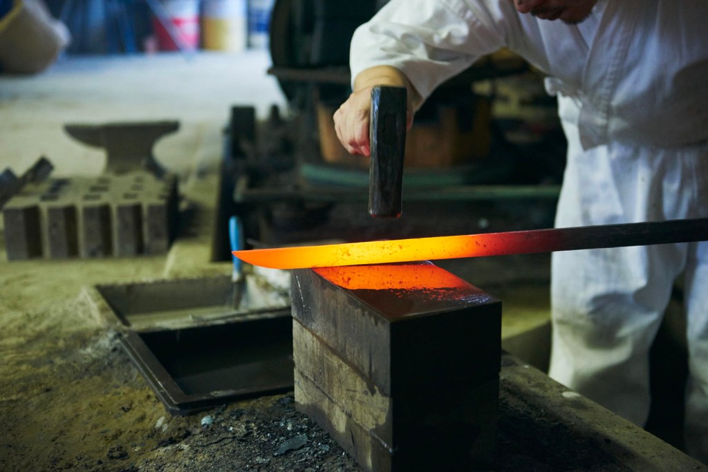 Conrad Tokyo, Sword Making, forge tamahagane steel with your own hands — a rare honour and rite of passage into Japan’s warrior heritage, Swordsmith hammering steel