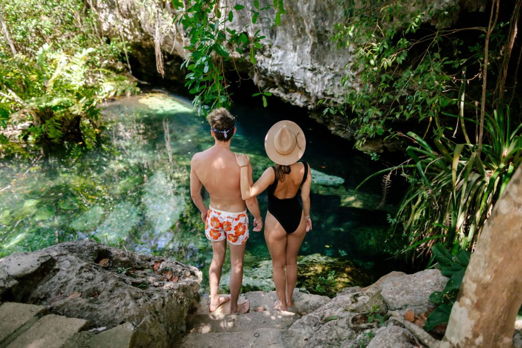 Guy and girl travel in Mexico and visit cenotes on the Yucatan peninsula, Sacred places of the Mayans, Unknown Mexico, Guy and girl in the jungle