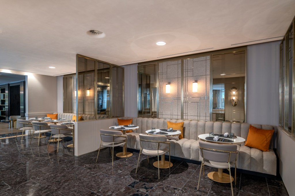 Hilton Turin Centre Malia Restaurant , booth tables and chairs set for lunch