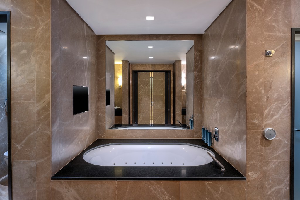 Hilton Turin Centre Presidential Suite Bathroom, view of bathtub and mirror