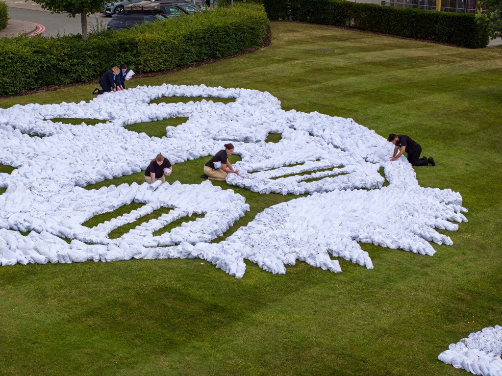 aerial view/close up of the towel art send off created at Hilton at St George's Park for Lionesses by Hilton, Official Hotel Partner of the England Teams