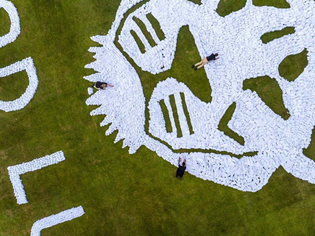 aerial view/close up of the towel art send off created at Hilton at St George's Park for Lionesses by Hilton, Official Hotel Partner of the England Teams