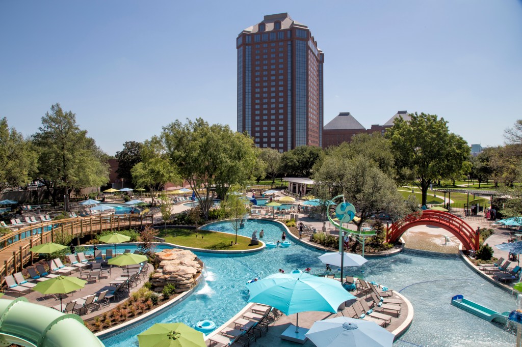 Hilton Anatole JadeWaters, water slides, lazy river, waterfalls, blue umbrellas, green umbrellas, red bridge, pool tubes