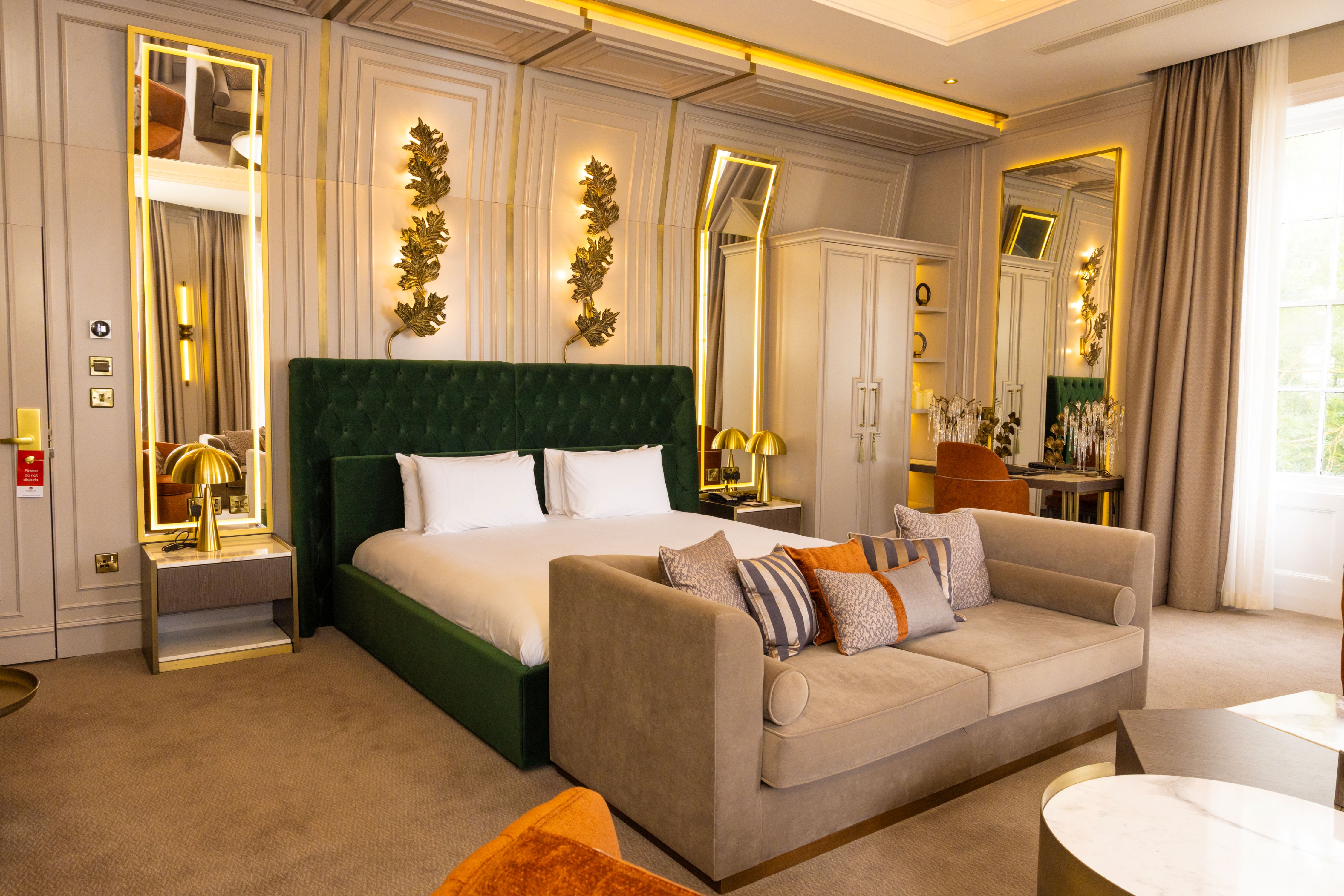 An elegant suite with a king bed and seating area