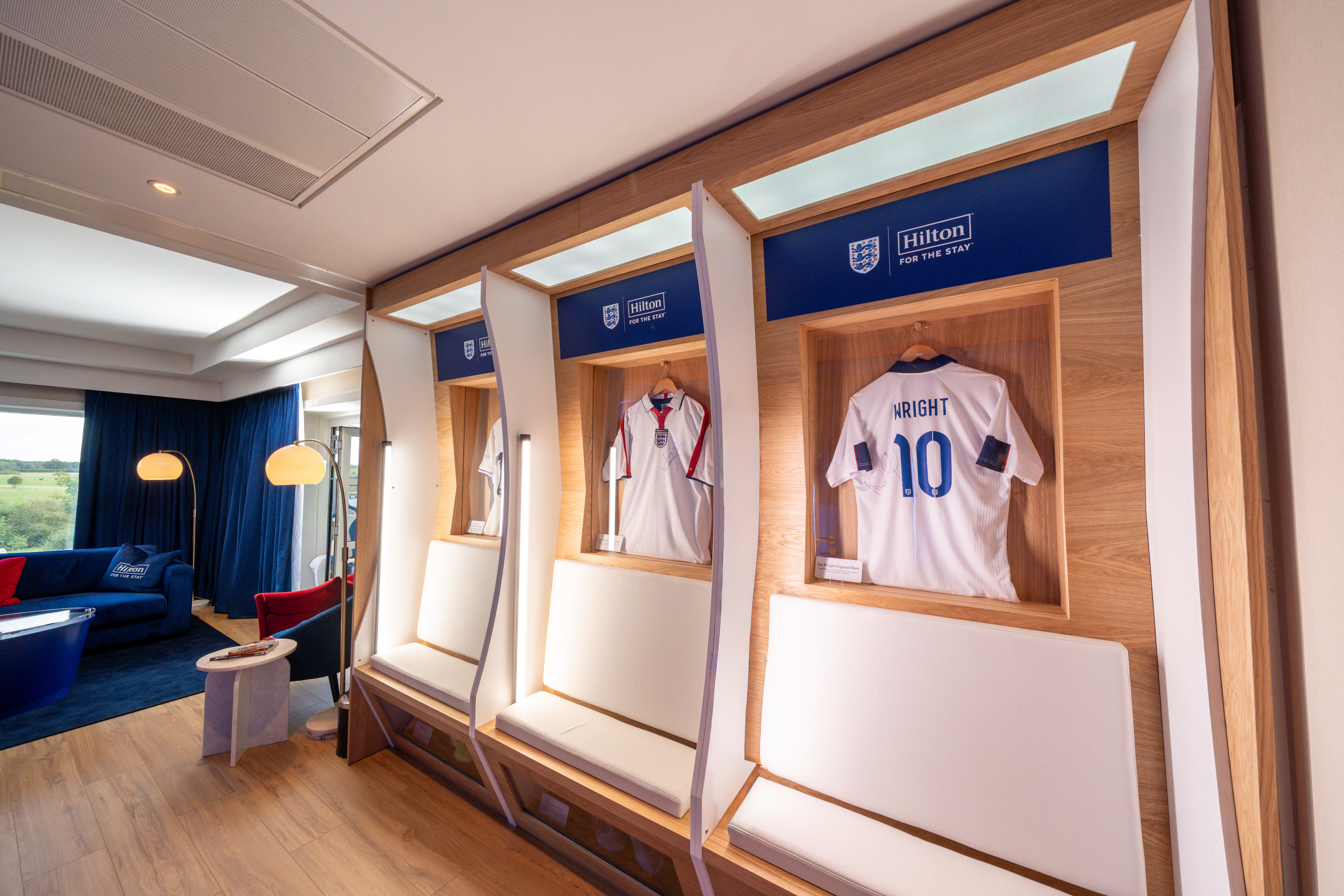 Jerseys of notable football players hung in the living area of the suite