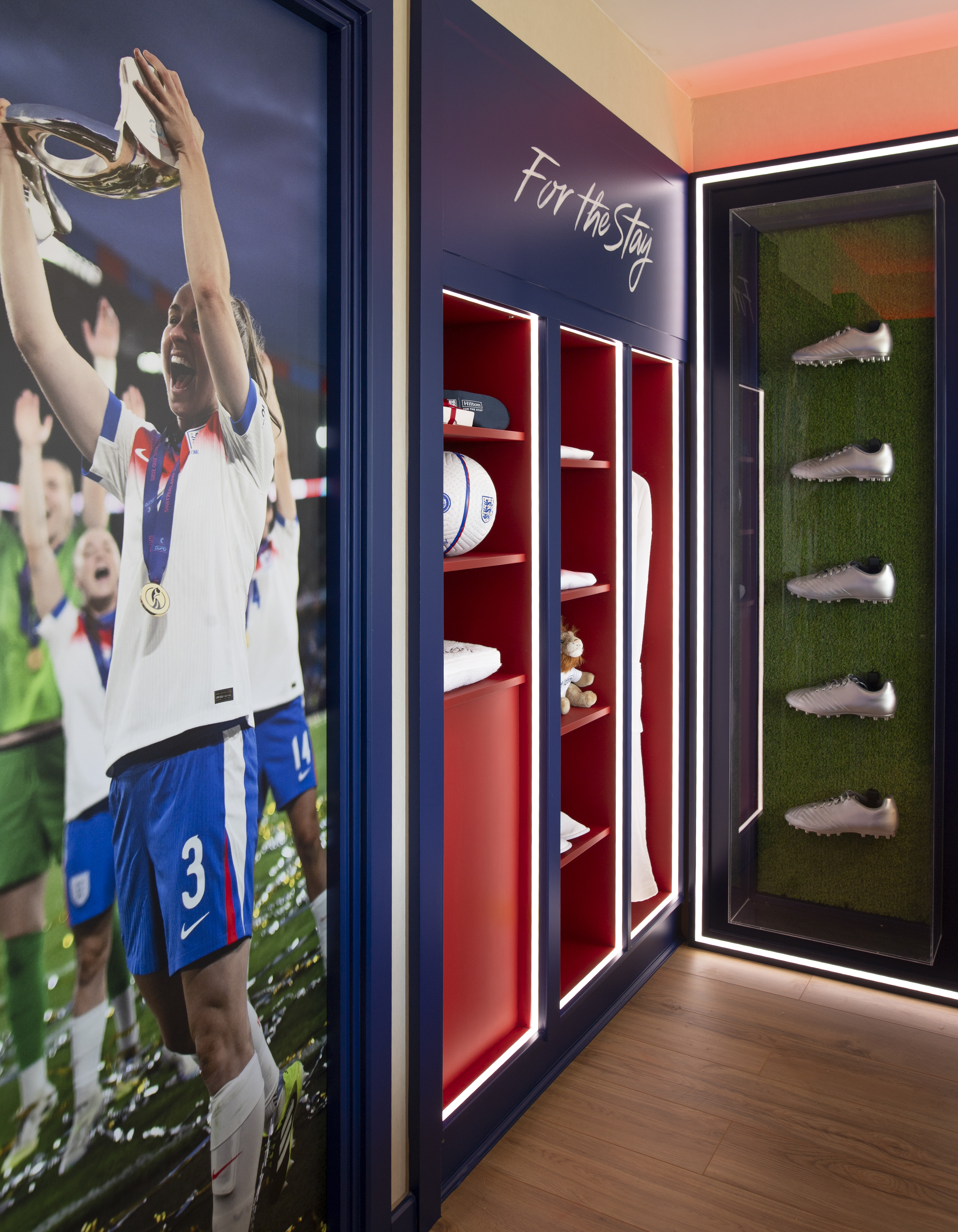 A close up of the wardrobe and memorabilia framing the bed