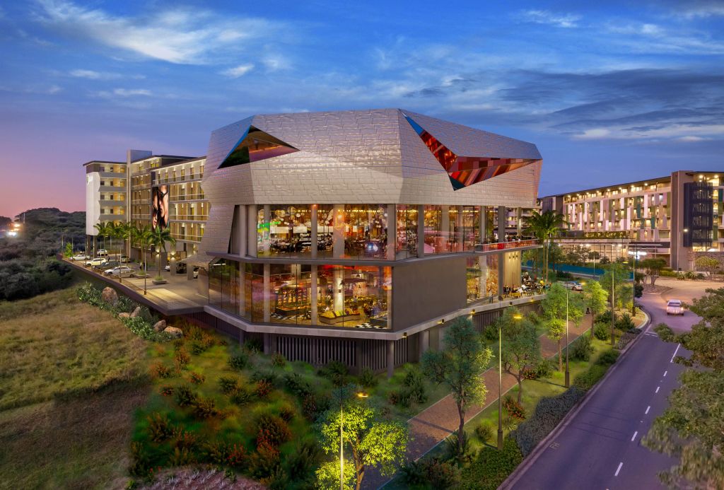 The exterior of the hotel from behind highlighting the floor to ceiling windows