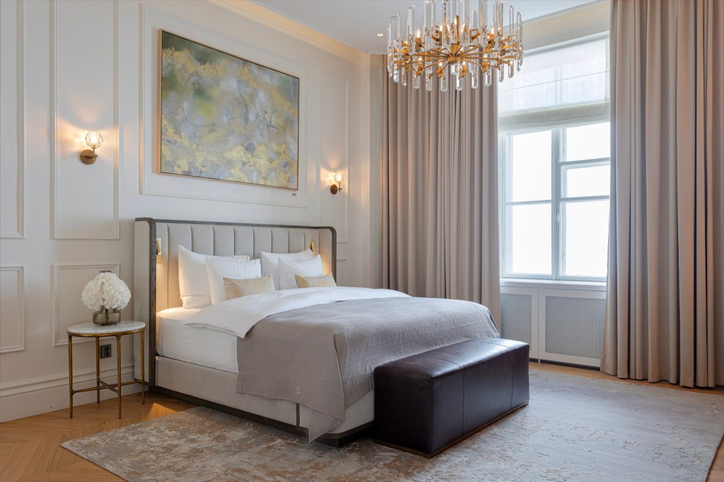 Stylish guest room with artwork and soft lighting.