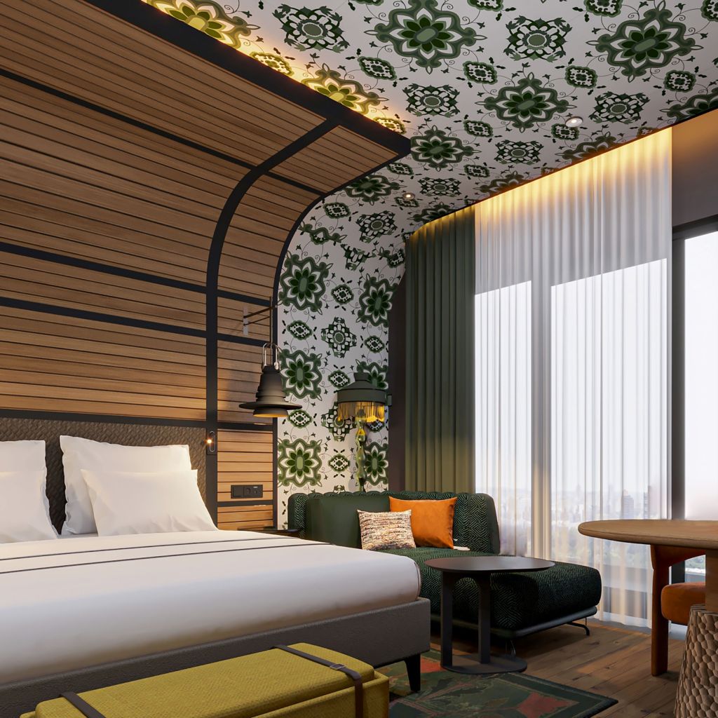 A room with bed and chaise