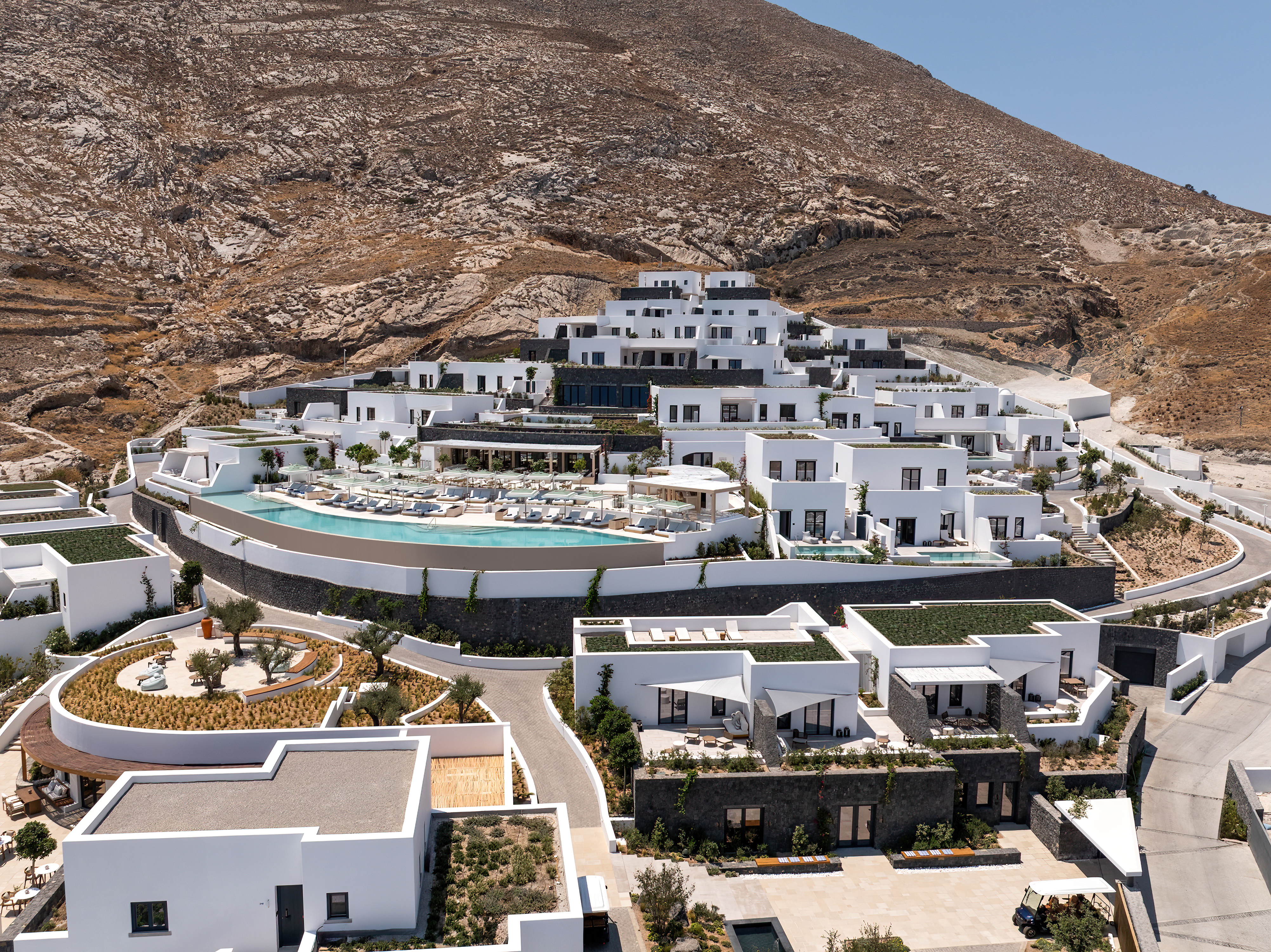 A bird's eye view of the hotel, with mountain behind