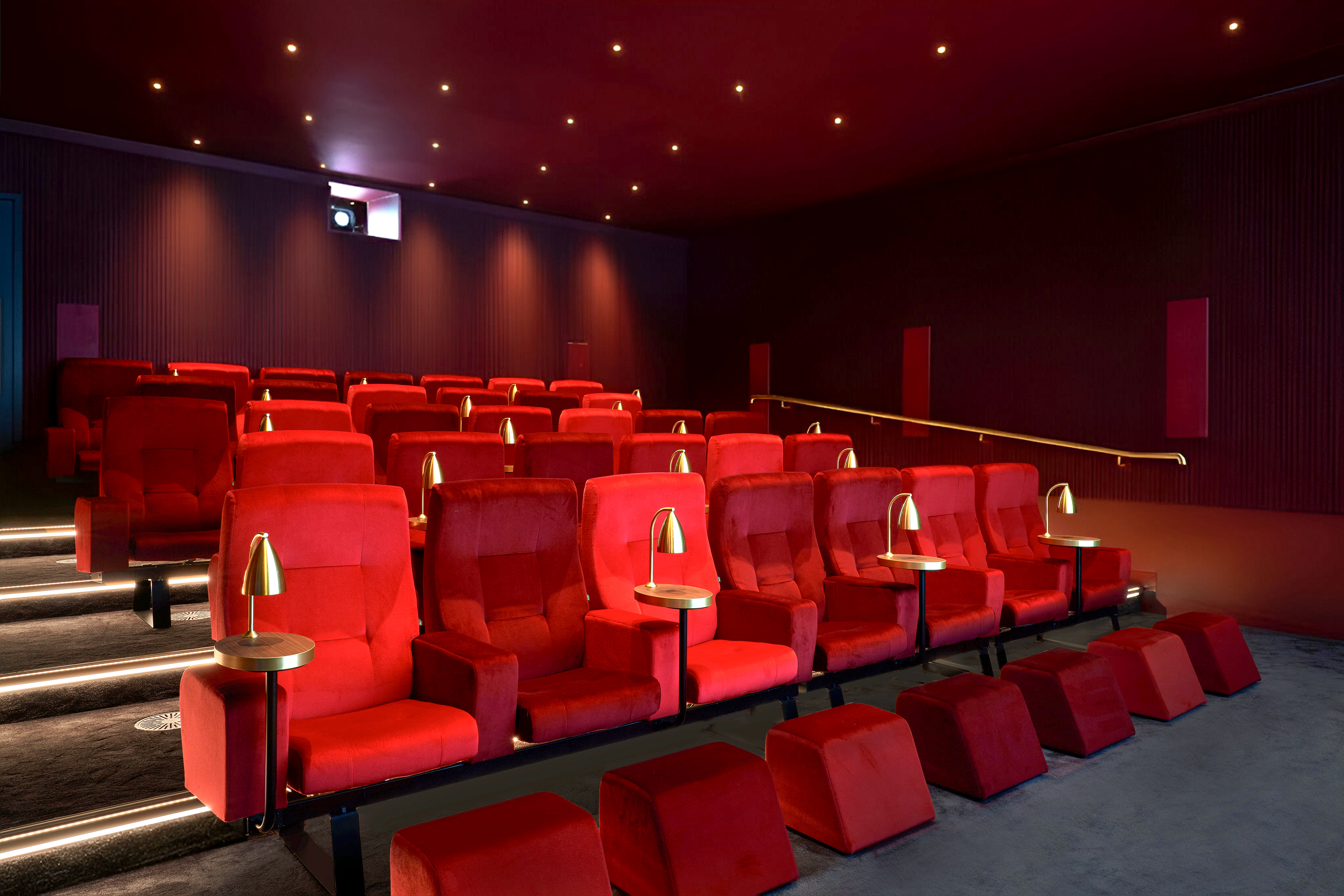 Cinema seating with plush red velvet chairs