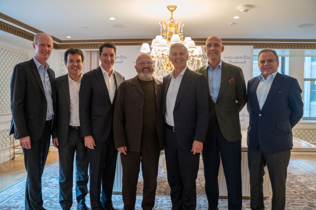 A group of men smiling at camera
