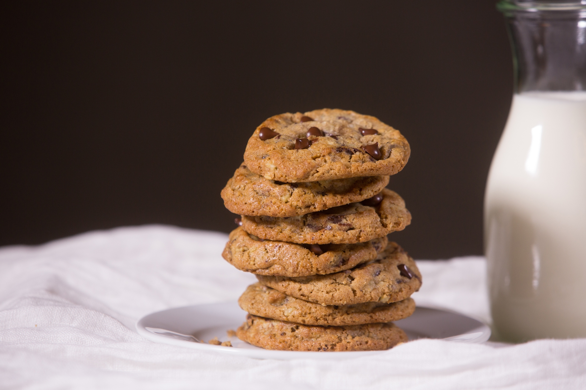 DoubleTree chocolate chip Cookie recipe stacked next to milk