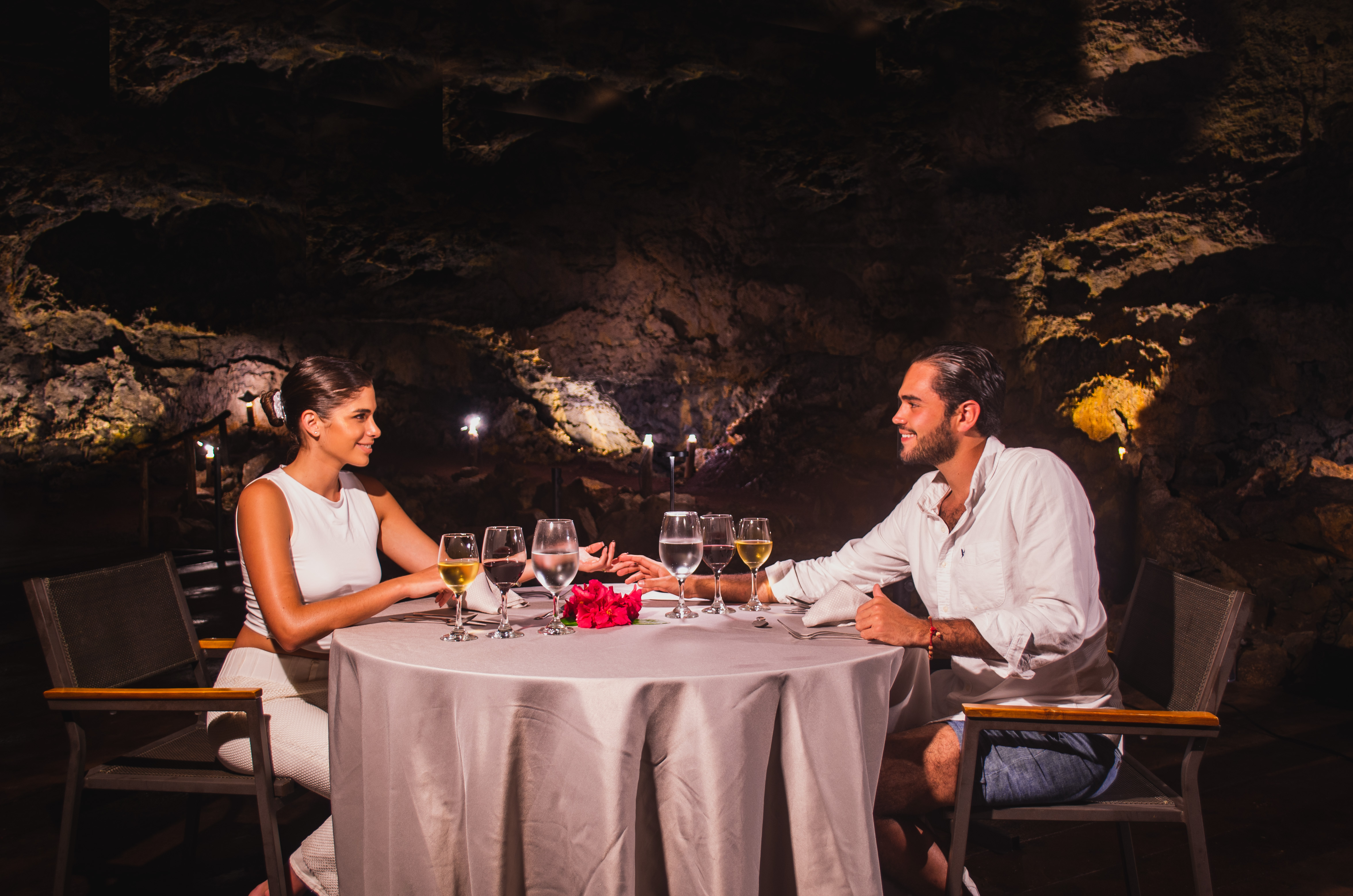 man, woman eating in cave lava tunnel fine dining luxury wine Royal Palm Galapagos, Curio Collection by Hilton Lava Tunnel