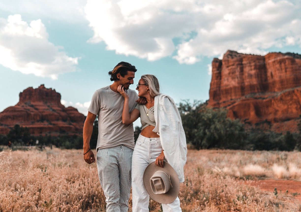 couple poses for photo Hilton Sedona Resort at Bell Rock
