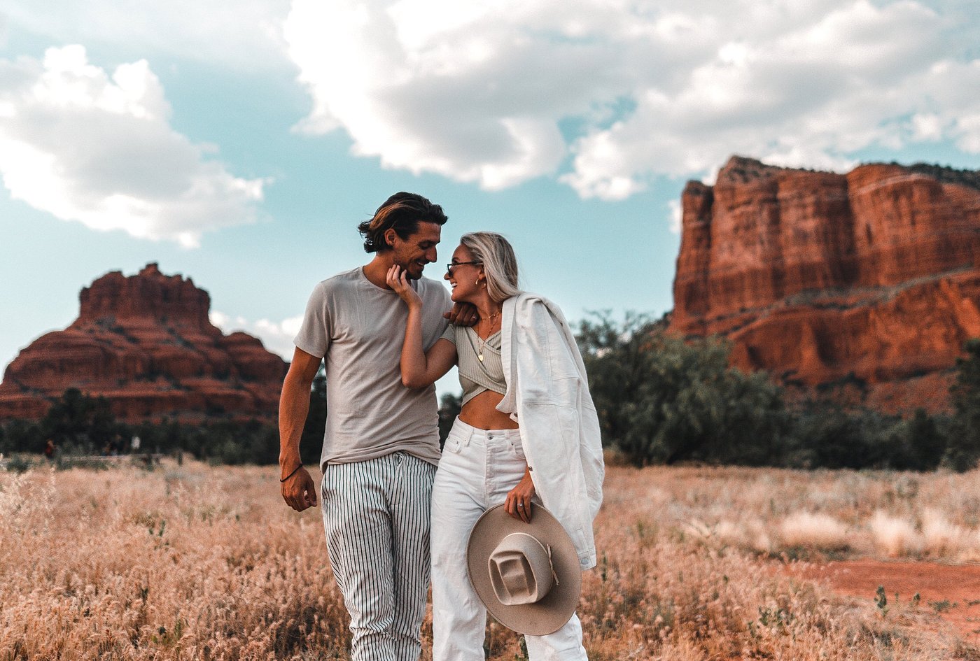 couple poses for photo Hilton Sedona Resort at Bell Rock