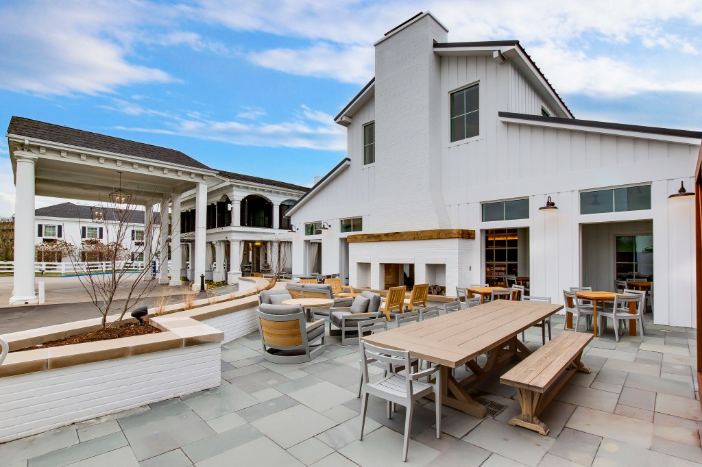 hotel exterior with seating area The Campbell House Lexington, Curio Collection by Hilton