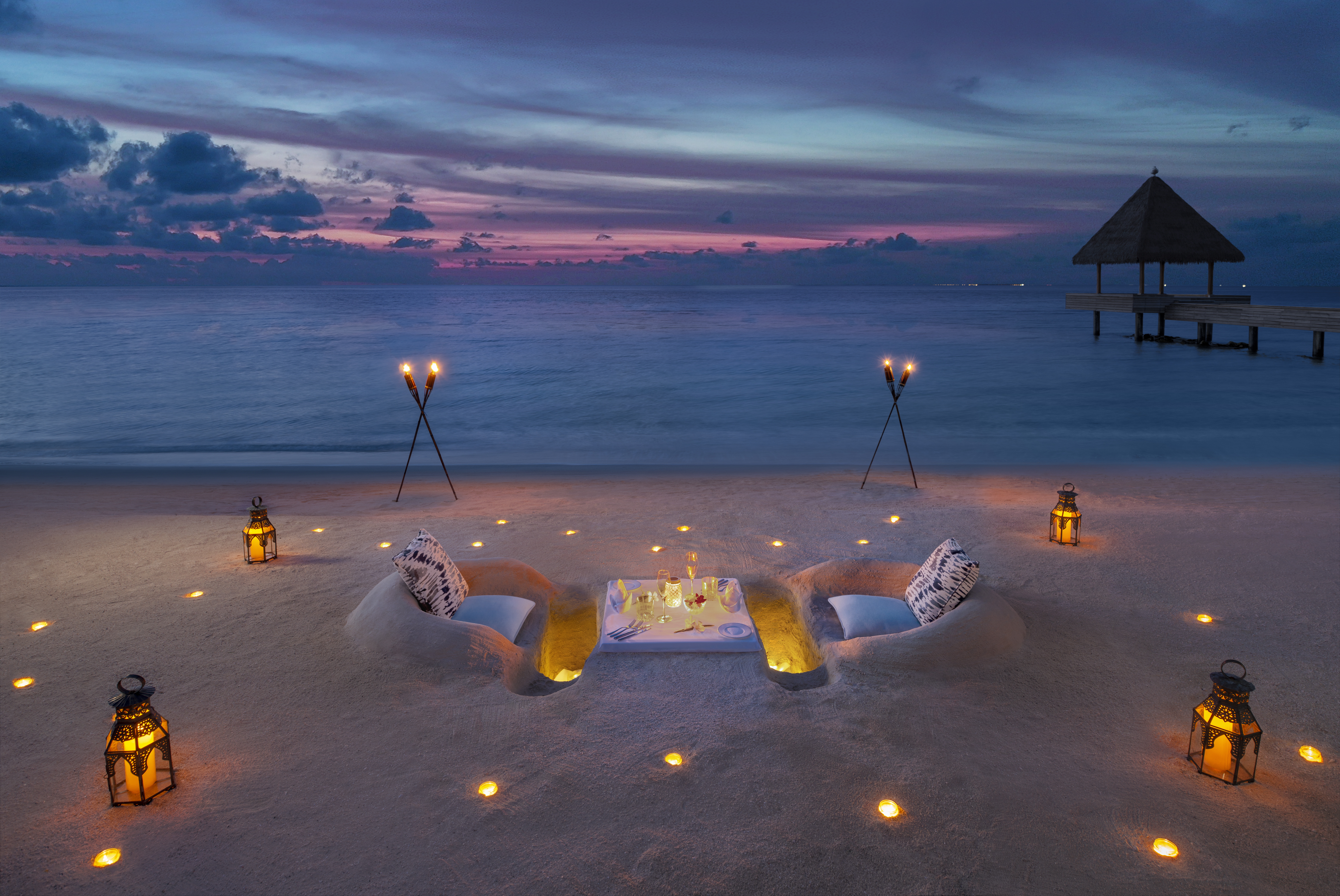 beach sand dinner sunset hotel Waldorf Astoria Maldives Ithaafushi